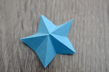 A blue paper star shape