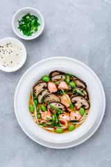 Salmon Noodle Soup with shiitake mushrooms, edamame beans and green onion.