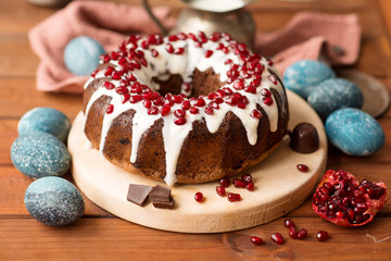 Chocolate cake and easter eggs are painted in cosmic blue. Easter menu.