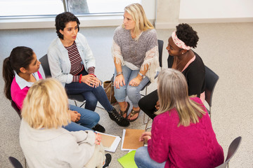 Women's support group talking in circle