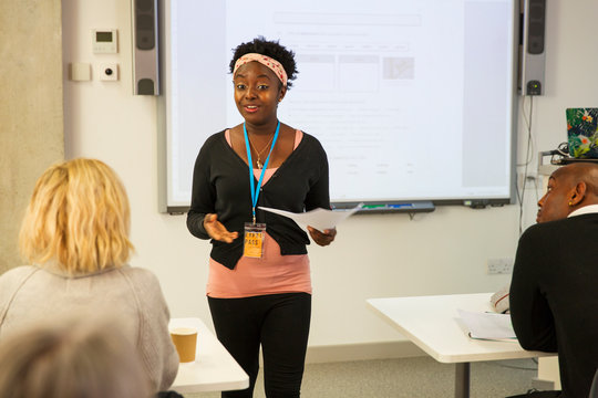 Female community college instructor leading lesson in classroom