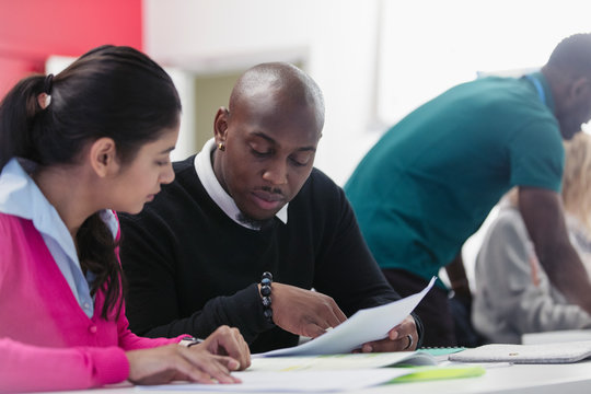 Business people discussing paperwork