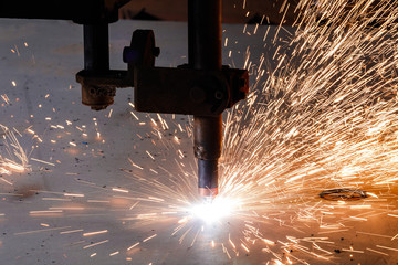 Plasma cutting of metal with a cnc. Plasma cutting machine cutting steel sheet. Laser cutter in...
