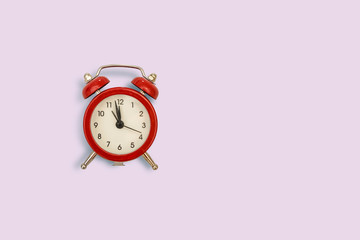 retro alarm clock on pink background. Concept of time with free space for text