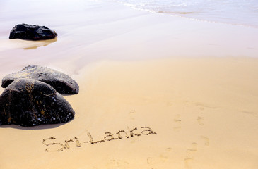 Sand beach of the Indian ocean at Mirissa, Sri Lanka. Hand written words on the beach. Memories of...