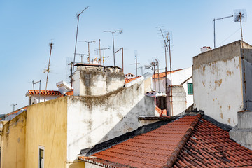 Fototapeta na wymiar Roofs and antennas in Lisbon in sunny daylight.