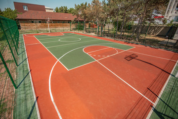 Basketball ground in a public park. Sports basketball court from different angles without people