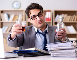 Young businessman drinking from stress