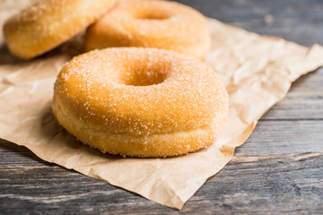 Donut with apple jam on the rustic background. Selective focus.