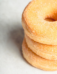 Donut with apple jam on the rustic background. Selective focus.