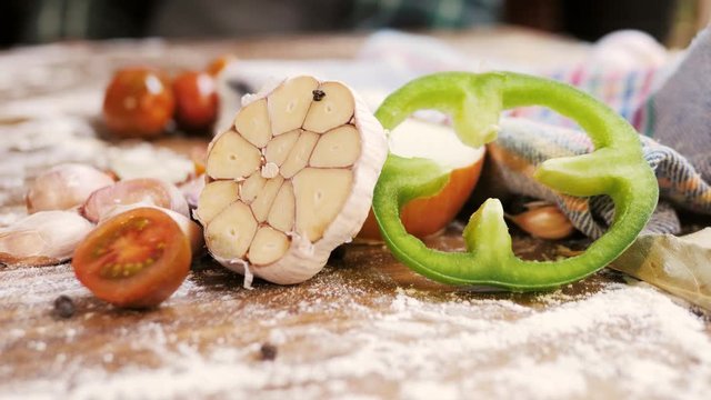 Fresh garlic herbs and spices on wooden background