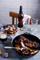 Roast Bavarian ham hocks with beer, caraway and juniper..style rustic.