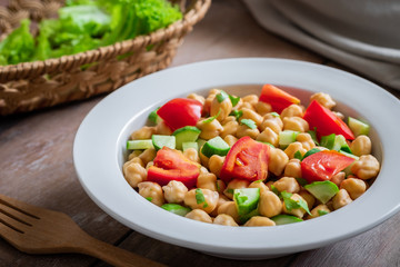 Chickpea salad in bowl, healthy vegan food.