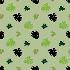 Seamless pattern with tropical leaves on light green background for plaid, fabric, textile, clothes, tablecloth and other things. Vector image.