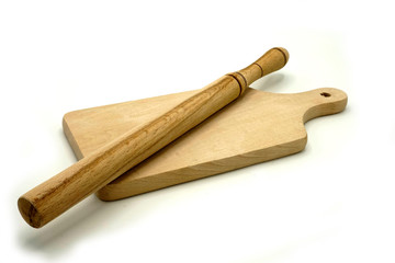 Wooden kitchen utensils on white background. Cutting board and shovels.