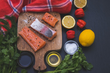 on a table ready for frying slices of salmon