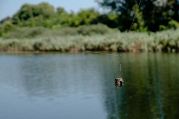 Feeder for fishing by the water