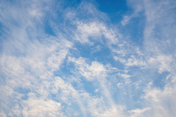 Beautiful blue sky with cirrus clouds. Natural background without focus, empty pattern for copy space