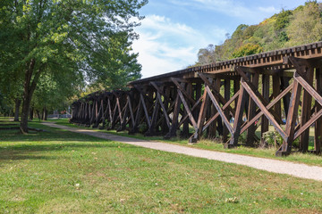 Old wooden railroad bridge in the forest