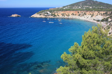 Naklejka na ściany i meble the coast of Ibiza in the Mediterranean sea on a beautiful sunny summer day