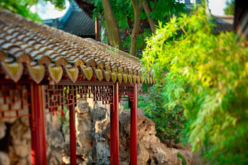 Traditional Asian style shed in public park in sunset warm light. Special lens used to obtain miniature selective focus effect.