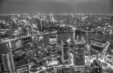 Aerial cityscape of Shanghai by night, black & white photo.