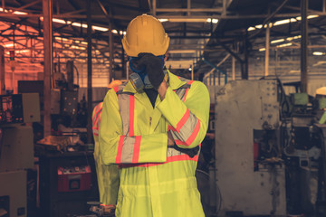 engineer working in industrial company with mechanical   receiving toxic substances.Hazardous substances the leak of a hazardous chemical in a chemical plant.  