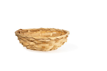 Obraz premium small wicker willow basket for fruit isolated on a white background. Healthy eating concept