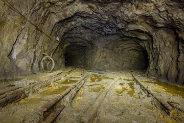 Copper mine underground tunnel with rails two ways