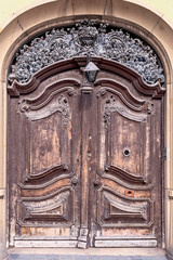 old wooden door with metal ornaments in the historical part of Budapest