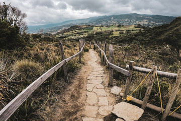 Fototapeta na wymiar Stone path with wooden railings