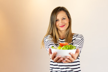 Woman with a salad in her hands