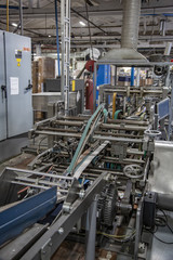 Industrial workshop of the Lambumiz plant. Production of laminated cardboard food packaging. Moscow, Russia