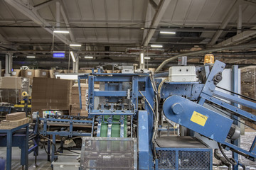 Industrial workshop of the Lambumiz plant. Production of laminated cardboard food packaging. Moscow, Russia