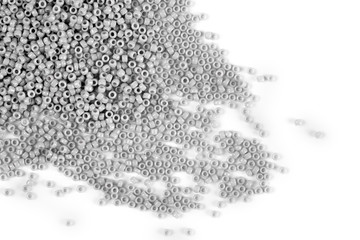 Scattering of colored beads on a white background