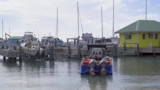 Philipsburg, St. Maarten - 17 JAN 2020: Motor boads and yachts in bay on anchor and docked