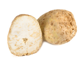 Celery root and its half isolated on a white background. Close-up.