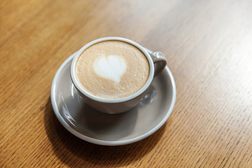 Coffee cup fresh cream organic cappuccino on table in cafe