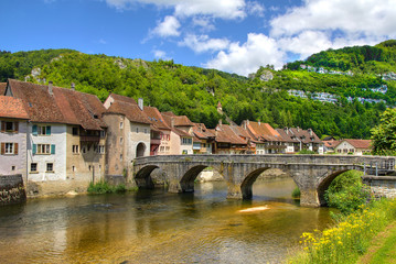 Fototapeta na wymiar The Famous Bridge Leading into Saint-Ursanne, Switzerland