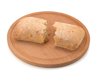 Ciabatta, Italian bread, on a wooden board, isolated on a white background