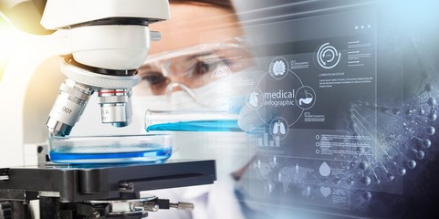 Young Female Scientist Working with Microscope