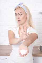 Woman refusing salt using gesture stop - health care concept.