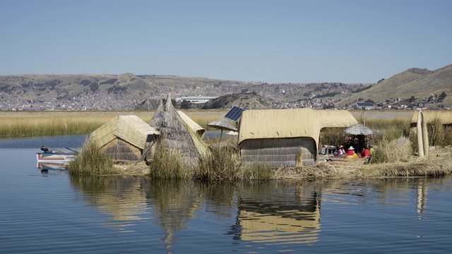 Traditional Uros floating reed islands on Lake Titicaca in the Andes Mountains at the border between Peru and Bolivia
