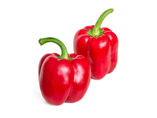 Two red sweet bell peppers on a white background