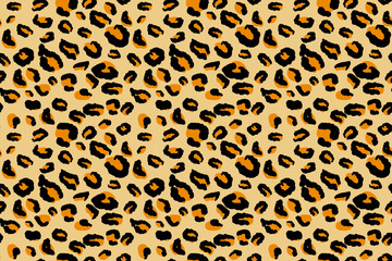 Leopard seamless pattern. Animal pattern in yellow, black and orange color.