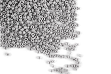 Scattering of colored beads on a white background
