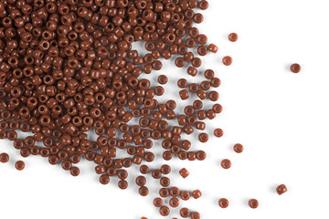 Scattering of colored beads on a white background