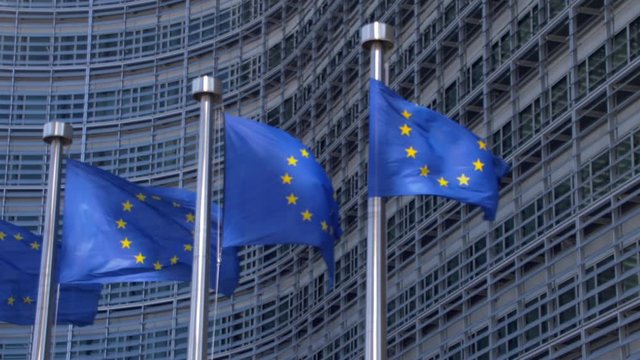 EU flags waving in front of European Commission building