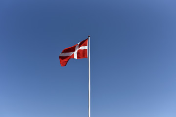 National flag of Denmark on flagpole