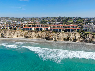 Aerial view of typical south california community condo next to the sea on the edge of the cliff during sunny day. Solana Beach. USA